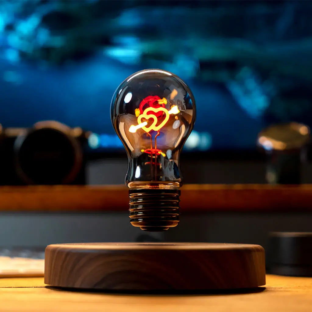Levitating Cupid heart light bulb glowing on desk floating two heart light bulb
