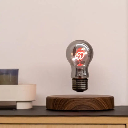 Cupid two heart magnetic levitating light bulb displayed on modern desk