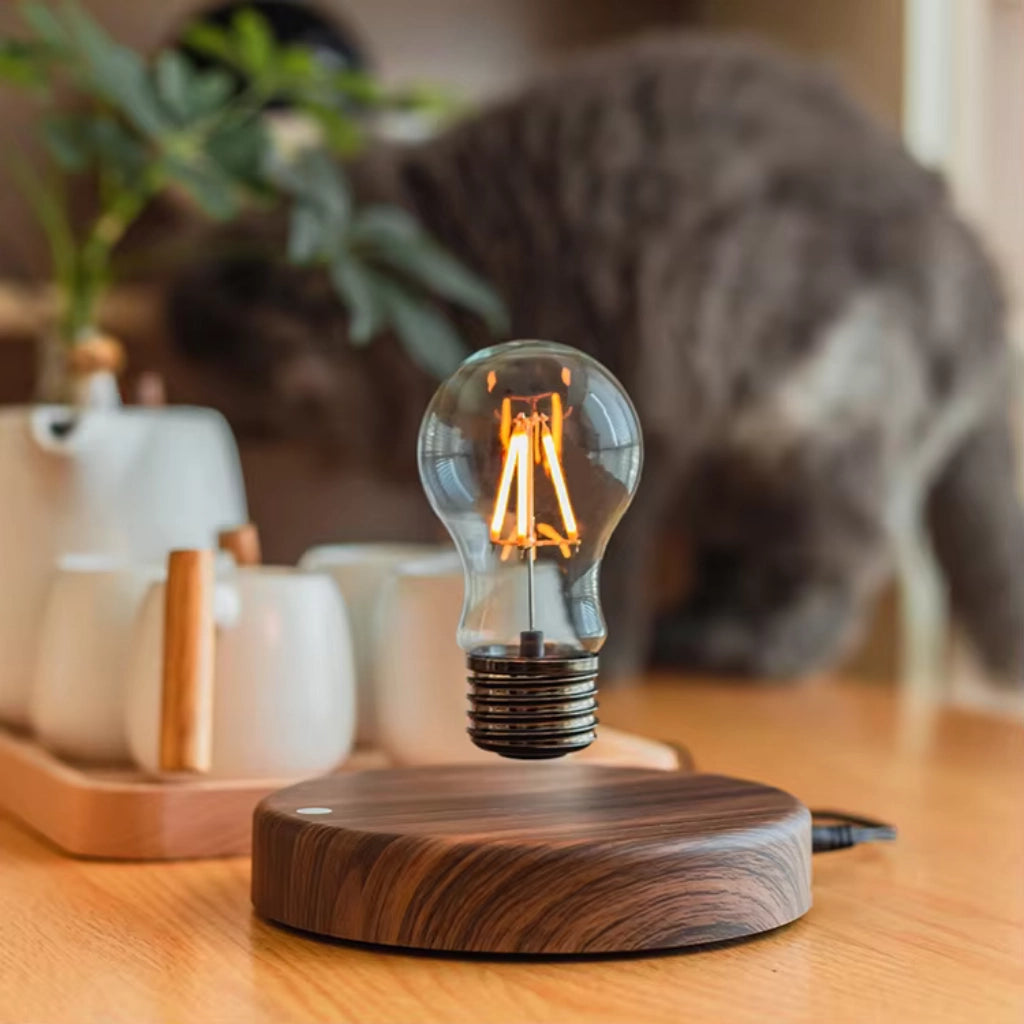 Classic light bulb magnetic levitating lamp on wooden base floating light bulb