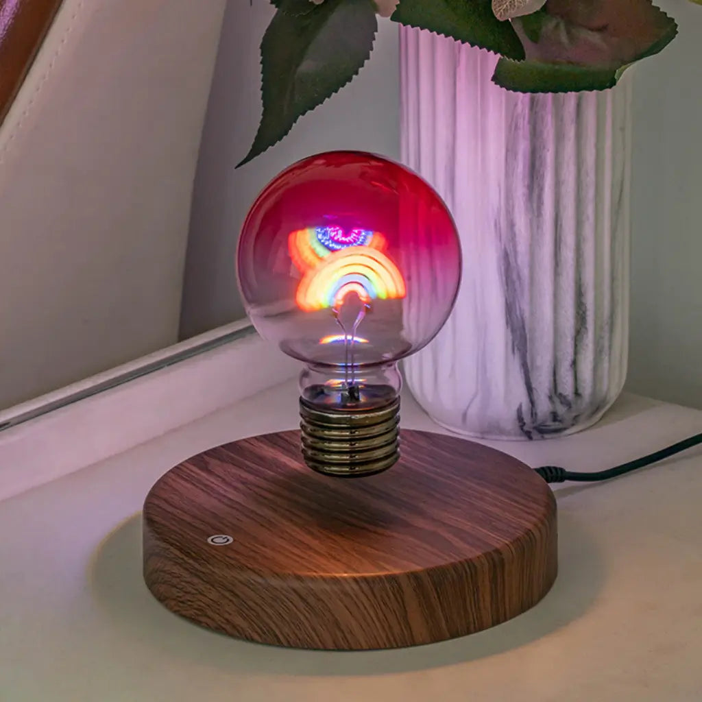 Floating rainbow bulb lamp levitating above wooden base in home decor setting
