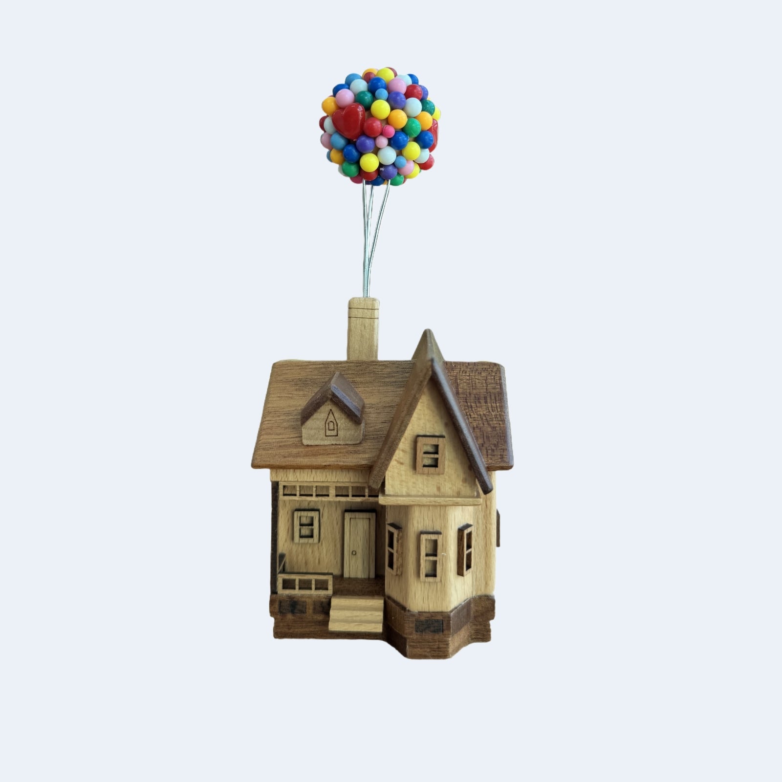 Floating wooden balloon house handmade toy with colorful balloons, magnetic levitation gift idea.